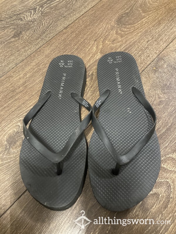 Stinky Black Flip Flops