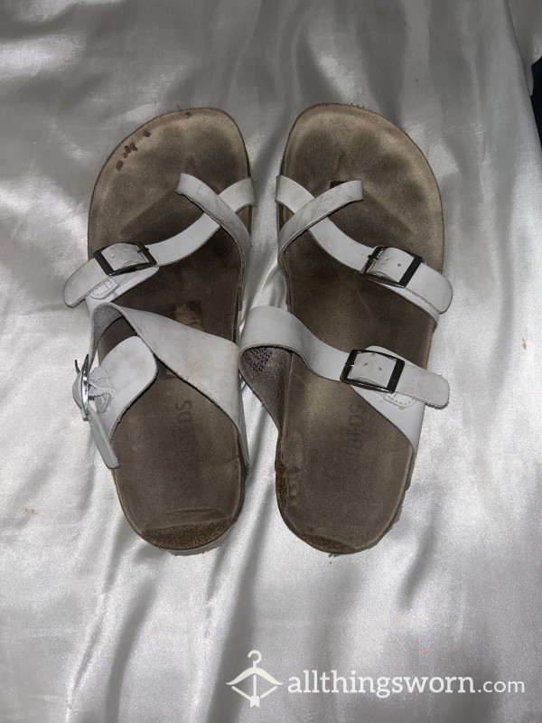 VERY WORN FLIP FLOPS