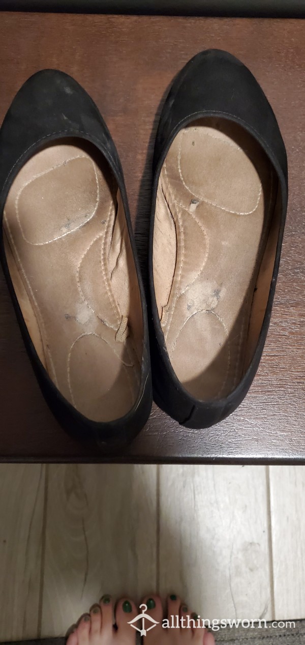 Well-worn Black Flats