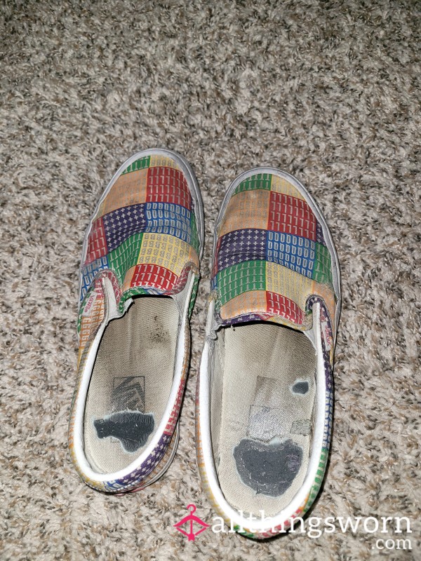 Well-worn Vans PRIDE Slip-ons