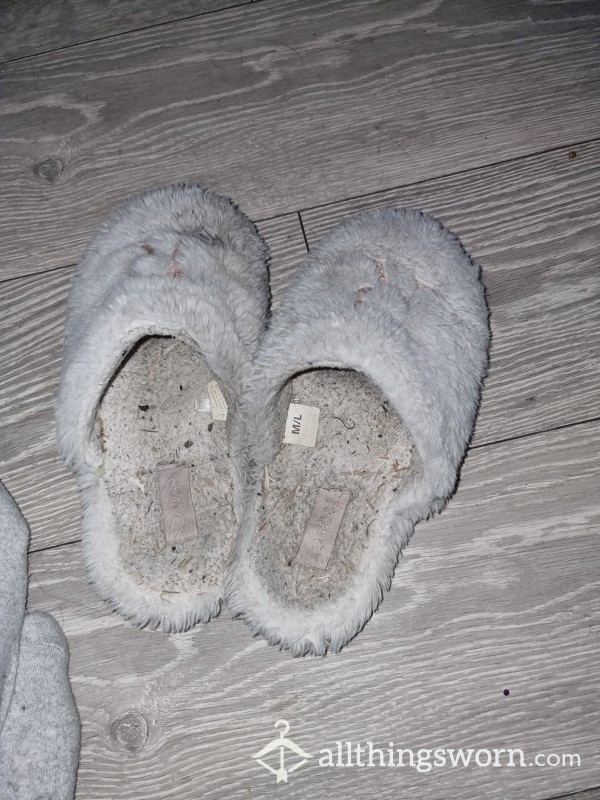 Well Worn White Slippers