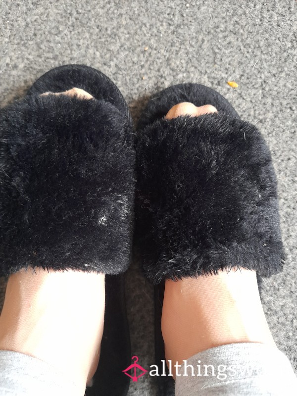 Worn Black Fluffy Slippers Waiting On A New Home