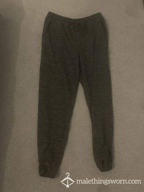 Worn Young Guys Dark Tracksuit Bottoms